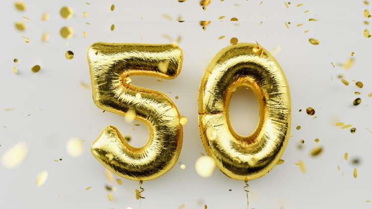Gold balloons spelling "50".