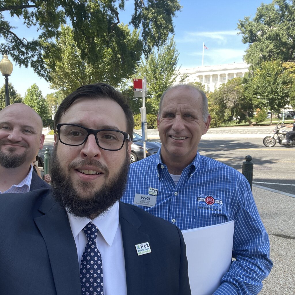 Three men in front of the U.S. Capitol